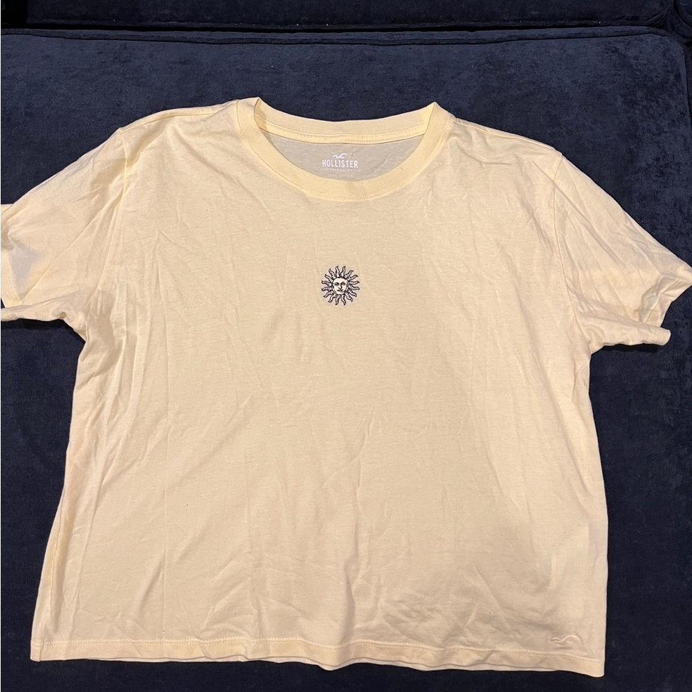Brand new Hollister sun, light yellow tee, size large, never worn!